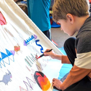 Tipi Tipi Art - Student painting on a tipi